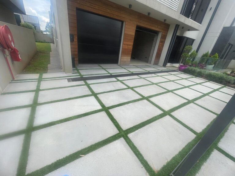 Light grey stepping stones with grass in between